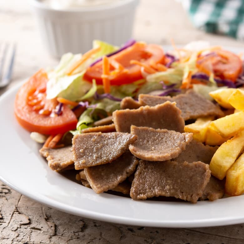 Gyro platter with vegetables and fries